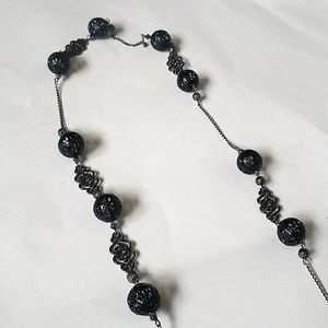 Long black necklace with matching earrings